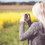 Girl Taking a Photo in Nature