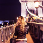 Blonde Girl Walking on Chain Bridge in Budapest